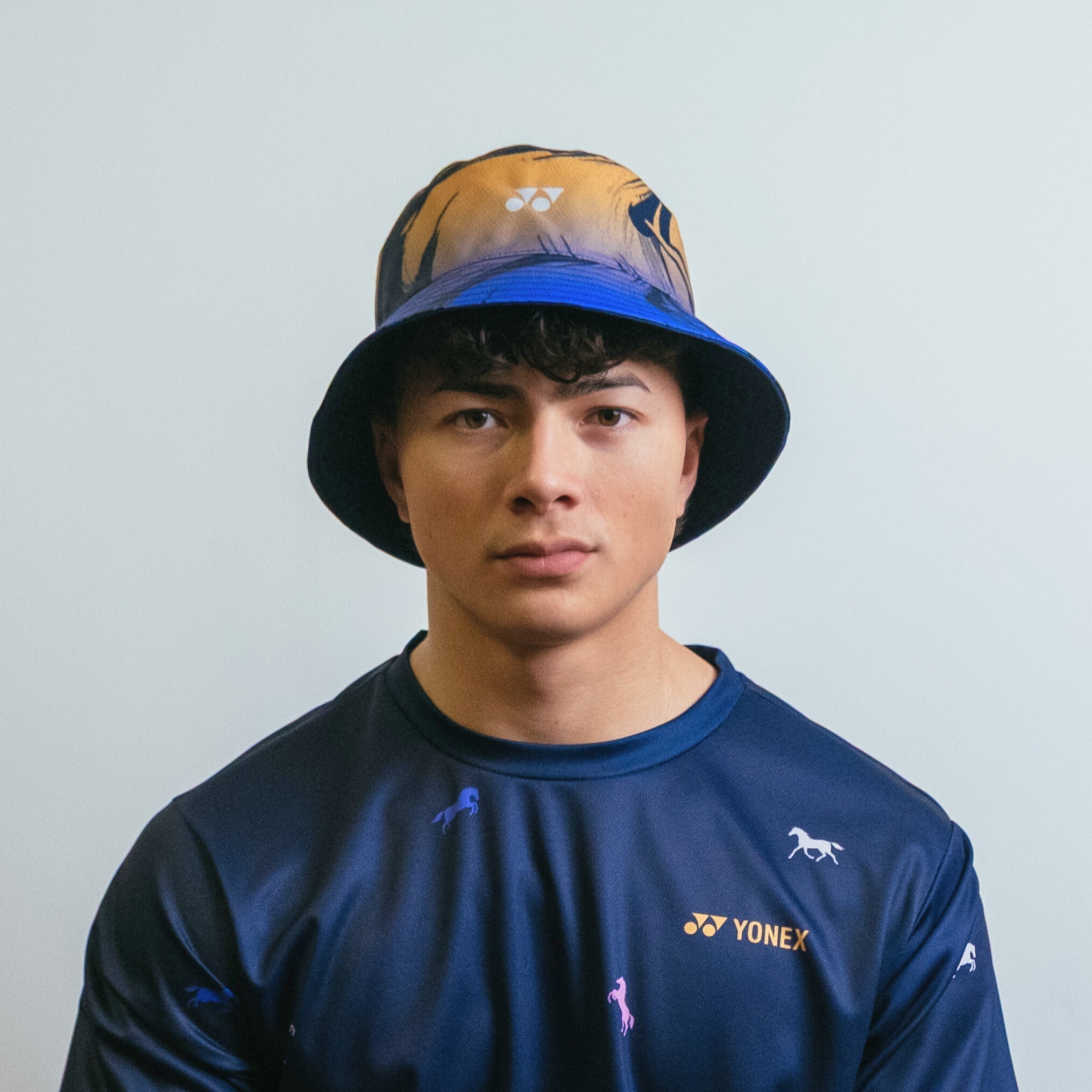 Yonex Legend’s Crown – Reversible Bucket Hat (Ink Blue | Celestial Purple / Pale Gold) Yonex CNY2026 Reversible Bucket Hat A Unisex Clothing Yonex